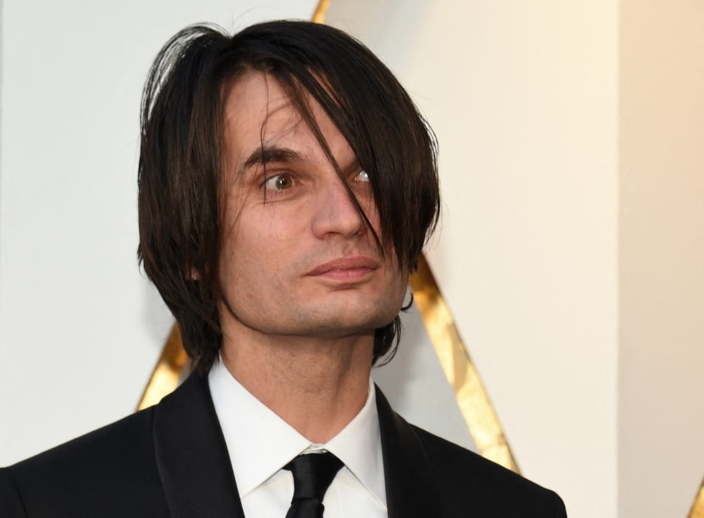 Radiohead em Crise: Guitarrista Treme em Meio a Ameaças de Boicote!